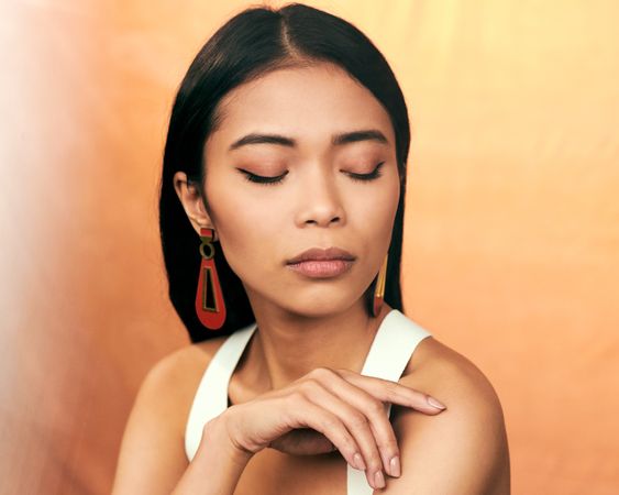 Portrait of a young woman with her eyes closed