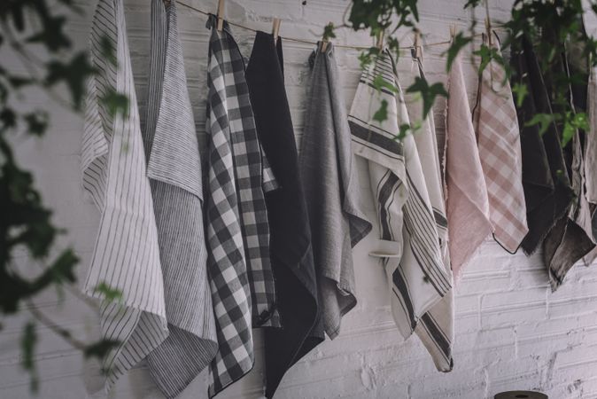 dish cloths hanging on twist with pins