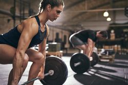 Woman focusing on proper lifting form