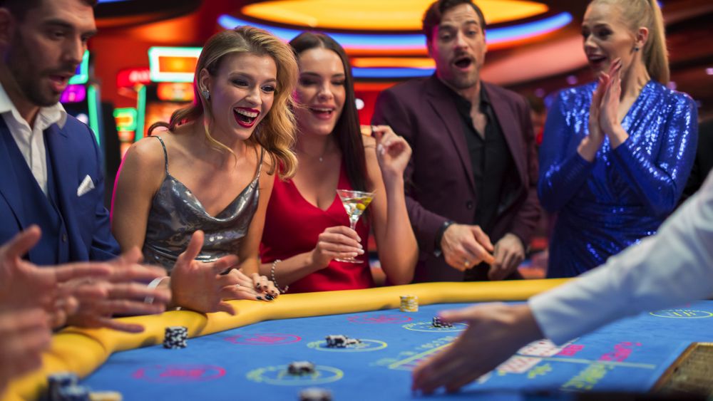 Glamorous Gamblers Having Fun, playing a Online Casino Card Game in Private Club