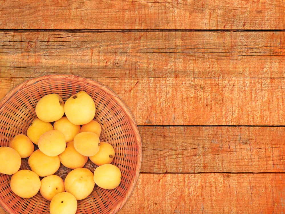 Apricots On The Wooden Background