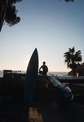 Man enjoying the sunrise in his camped van
