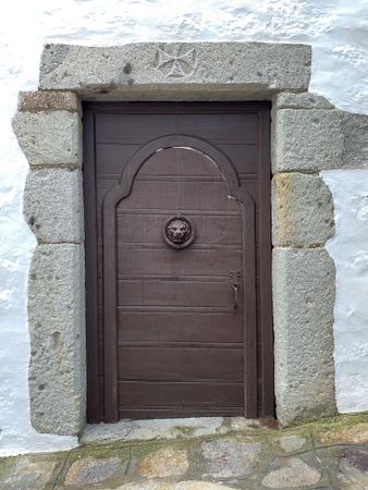 Patmian brown door with lionshead