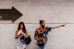 Couple searching for direction while strolling on street