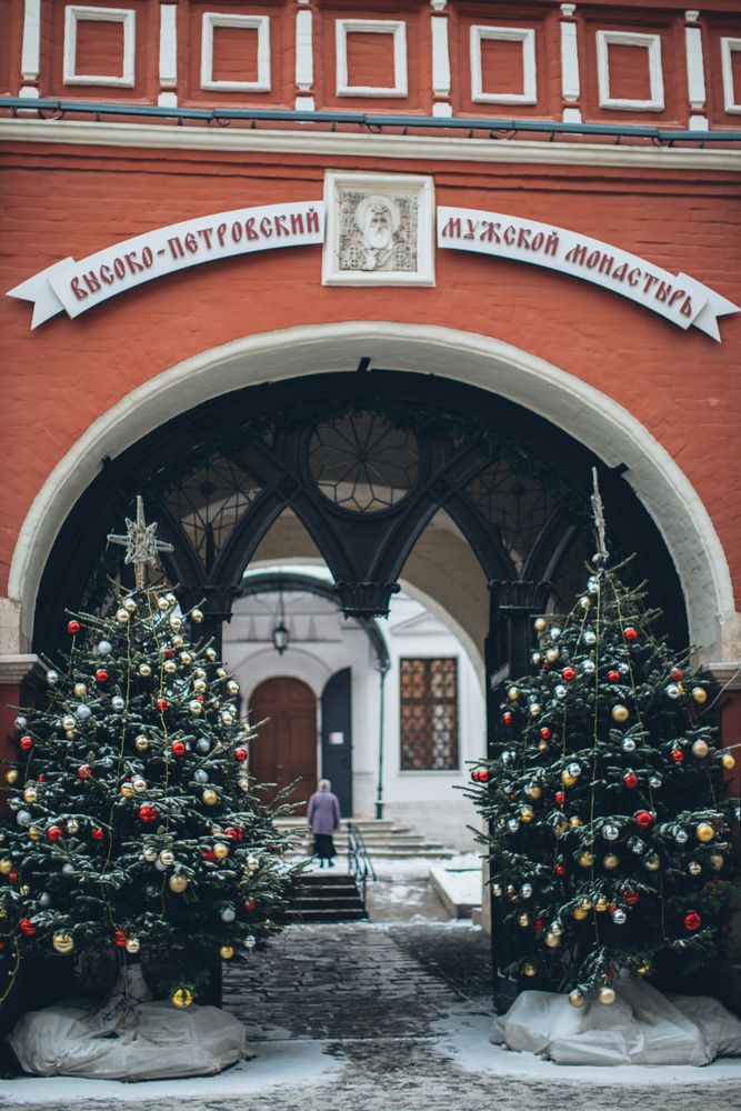 The Church of St. Igor of Chernigov's gate with two Christmas trees