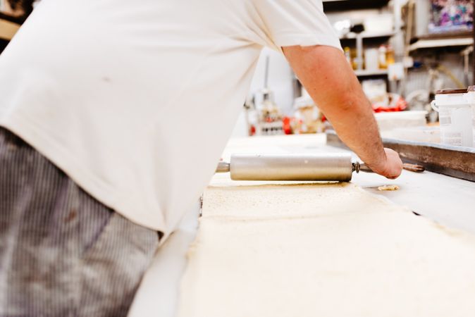 Crop cook rolling pastry dough