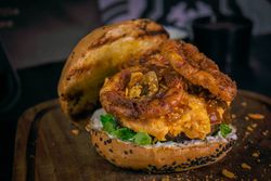 Delicious pub burger with onion rings