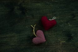 Valentine's day concept of thatched heart decorations on wooden table with copy space