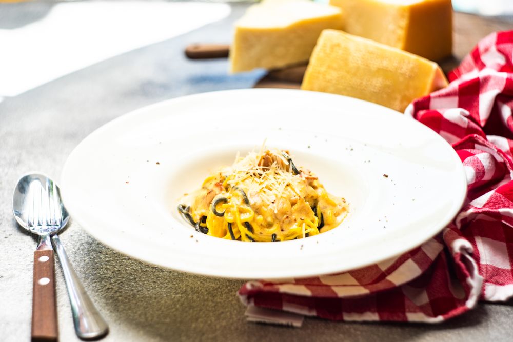 Italian homemade pasta served with checkered napkin