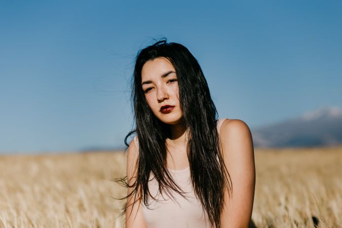 Portrait of woman standing in field