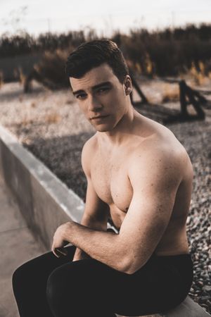 Strong male near concrete wall