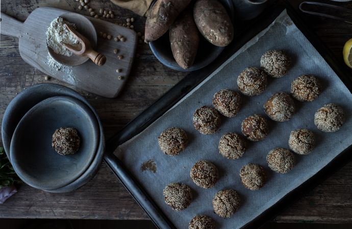 Set of sweet potatoes in sesame seeds on table
