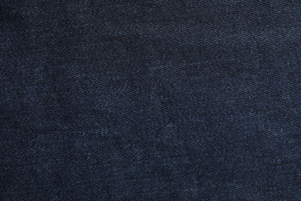 Texture of blue jeans as background, space for text