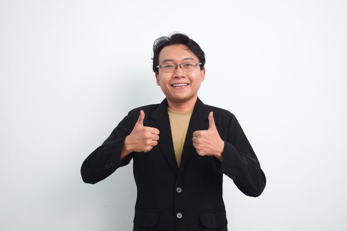 Asian Businessman doing ok agreement hand sign