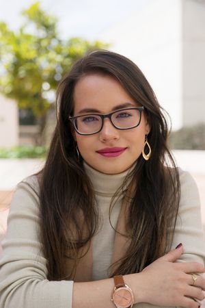 Woman in glasses looking at camera