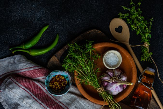 Top view of herbs, garlic and seasoning on counter