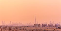 Hazy sky over city in desert