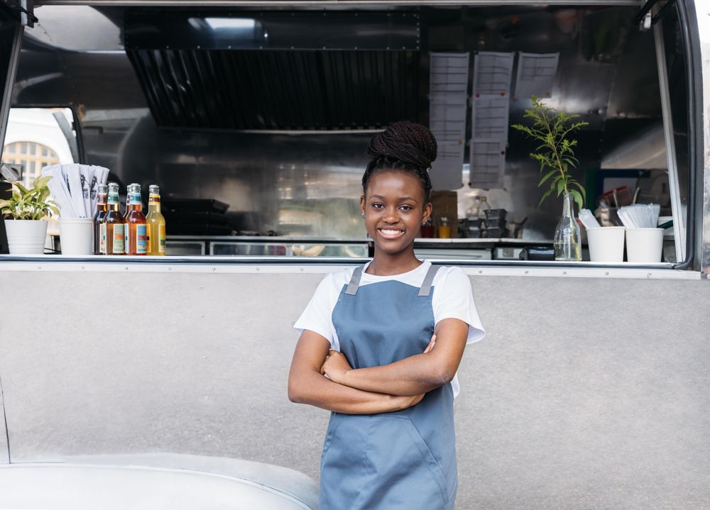 Saleswoman with arms crossed looking away