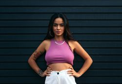 Portrait of a latina with tattoos and piercings outdoors