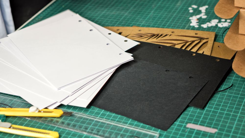 Paper with holes of hole puncher on table in warehouse