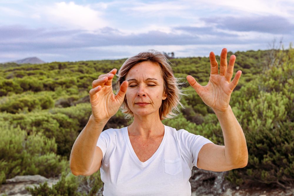 Adult woman practicing martial arts in nature