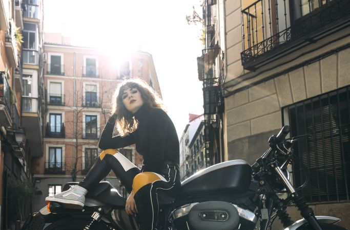 Young woman in custom motorbike