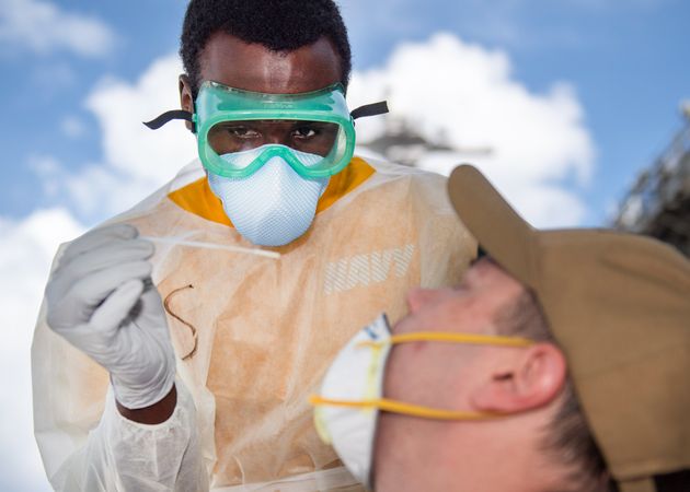 APRA, Guam - April 22, 2020: Hospitalman takes a nasal sample from a U.S. Sailor
