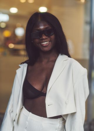 London, England, United Kingdom - September 18 2021: Smiling Black woman in light open blazer