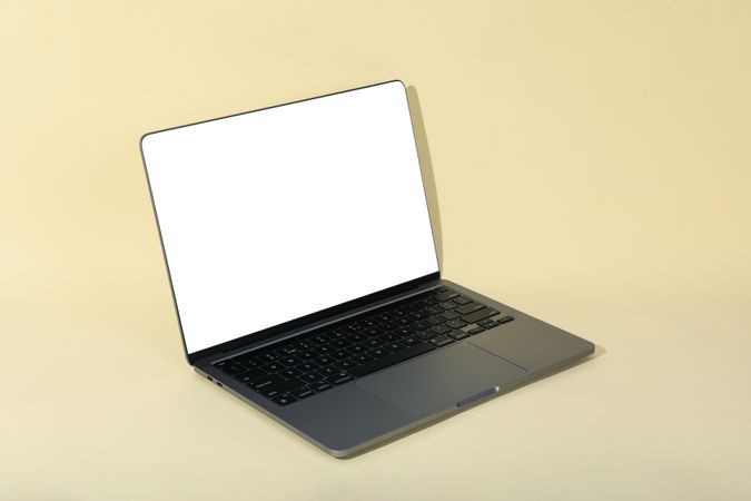 Laptop with mock up screen in cream room