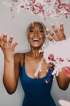 Excited Black female having fun with serpentine