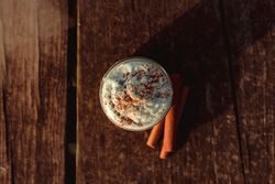 Cinnamon near coffee on table