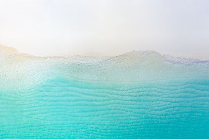 Aerial shot of the clear sea at a tropical beach