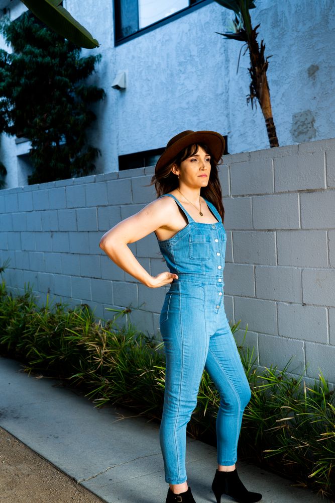 Transgender woman with hand on hip