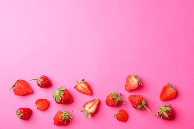 Flat lay composition with strawberries on color background, space for text. Summer sweet fruits and berries