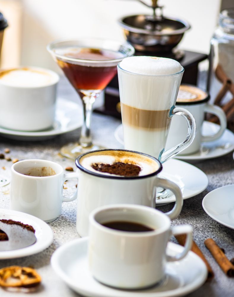 Variety of coffee drinks and cocktails with heart shape topping