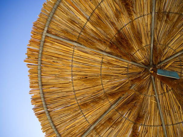 Looking up at sunbed bamboo umbrella