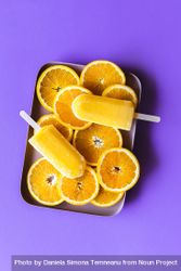 Orange ice cream popsicles on a tray 47MYa0