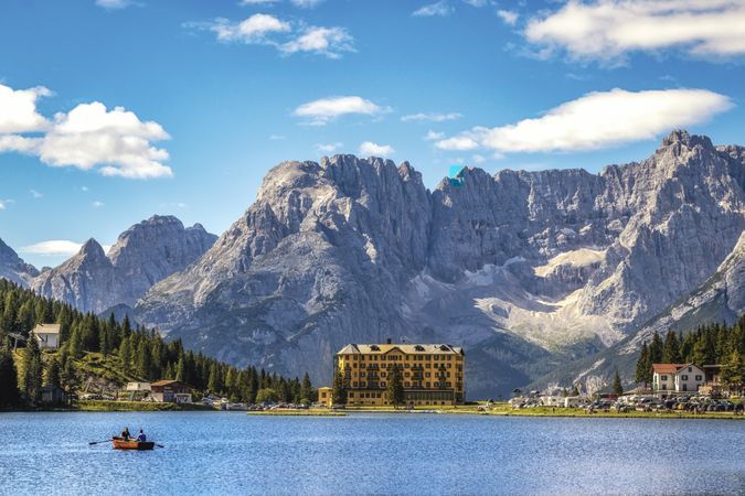 Two people on boat in lake Misurina in Parco Naturale Tre Cime in Italy