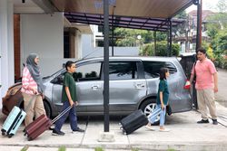 Happy Asian Muslim Family Going on Mudik Road Trip Back Home During Eid Mubarak Celebration