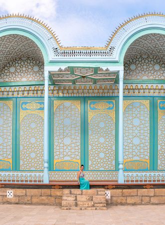 Woman leaving ornamental building