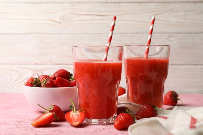 Composition with strawberry cocktails on pink table. Summer drink