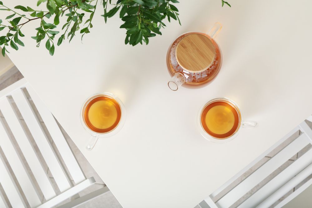kitchen table with tea and plant