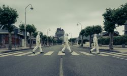 People with bacteriological protection suits in a crosswalk