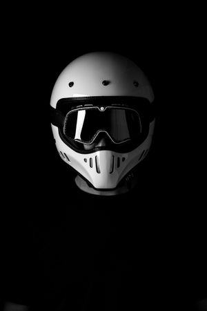 Rider in helmet and glasses at studio