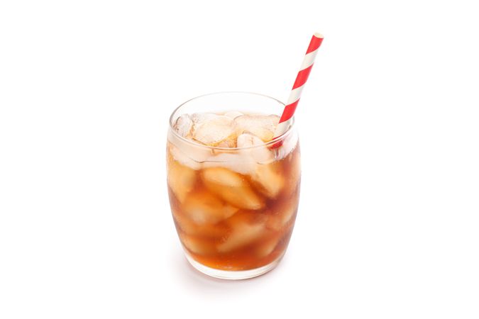 Glass of cold cola isolated on blank background