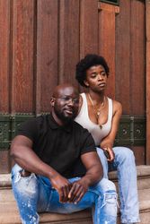 Black woman sitting with boyfriend
