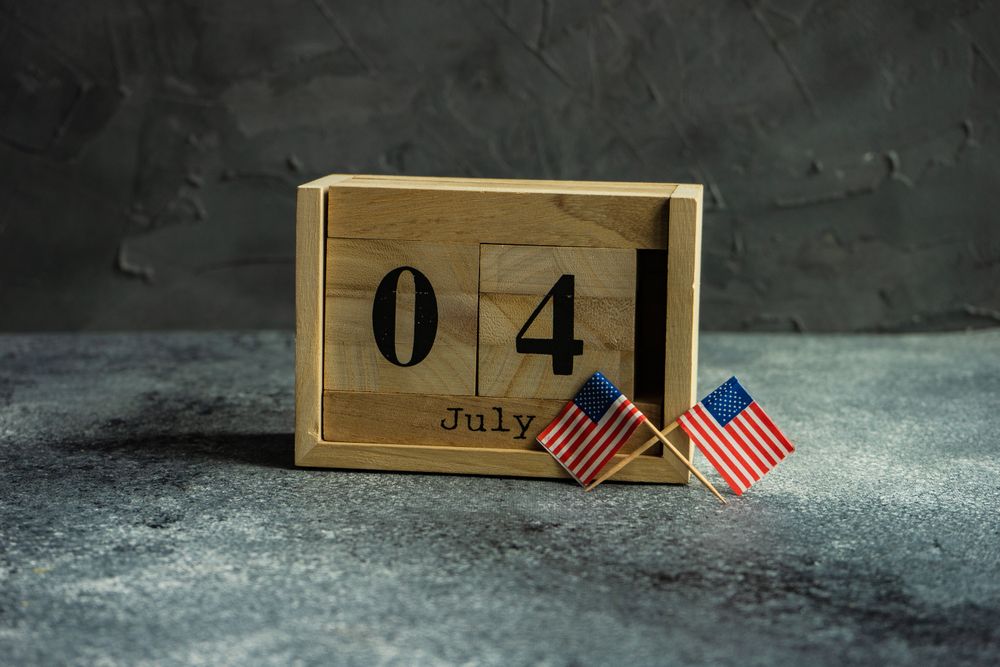 USA flags for Independence Day on grey counter