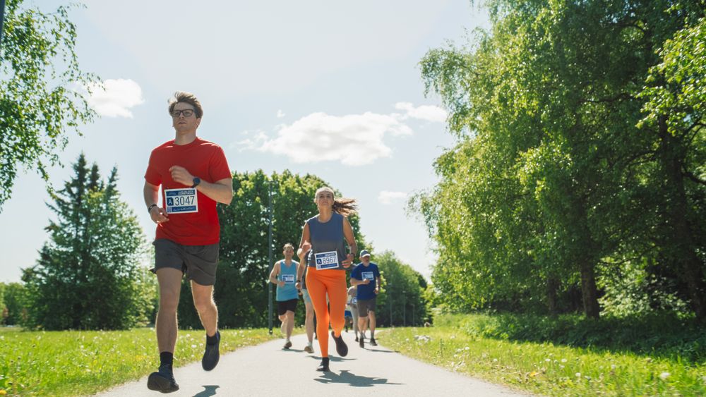 Joggers Casually Competing for the First Place on a Friendly Race