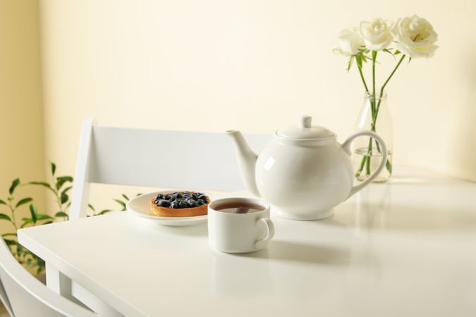Concept of breakfast with blueberry pie on table