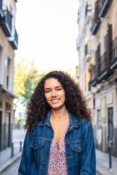 Portrait of a cheerful Black Latina woman outdoors